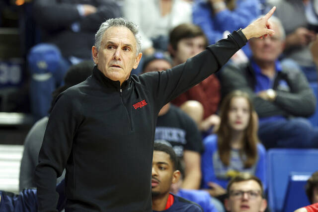 Duquesne head coach Keith Dambrot directs his team Nov. 11 in their game against Kentucky in Lexington.