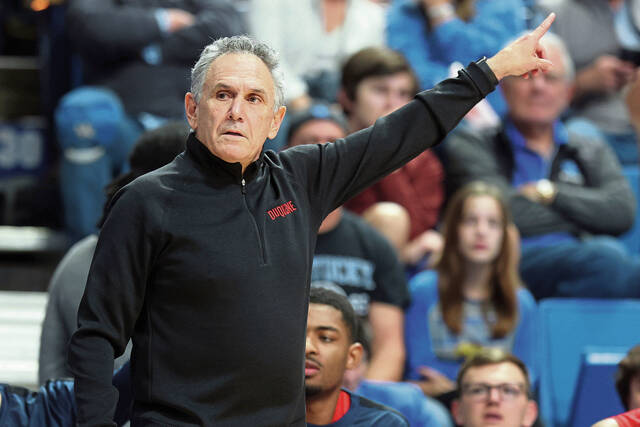 Duquesne head coach Keith Dambrot directs his team during the first half of an NCAA college basketball game against Kentucky in Lexington, Ky., Friday, Nov. 11, 2022. (AP Photo/James Crisp)