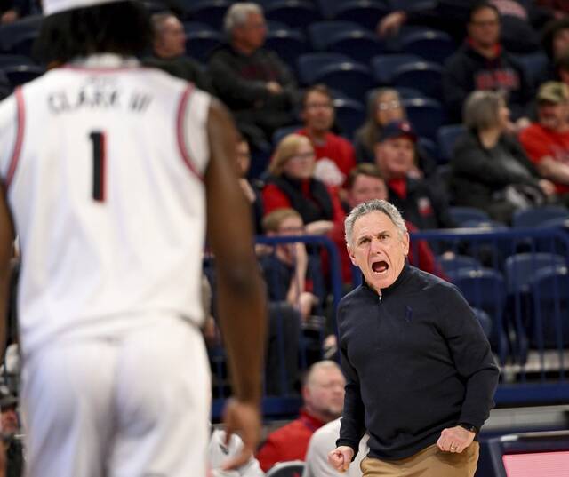 Duquesne head coach Keith Dambrat has words for Jimmy Clark III after Ball State hits an easy three-pointer Dec. 3, 2022, at UPMC Cooper Fieldhouse.