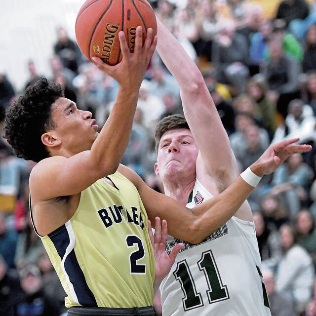 Butler’s Devin Carney drives to the basket past Pine-Richland’s Luke Shanahan during their game on Friday, Feb. 4, 2022, in Pine..