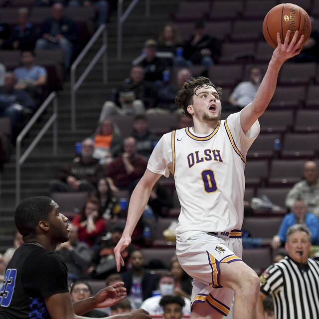 OLSH’s Jake DiMichele scores past Constitution’s Jamal Carr during the PIAA Class 2A state championship game Friday, March 25, 2022, at Giant Center in Hershey.