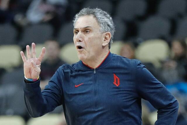 Duquesne coach Keith Dambrot signals to his team in a 2020 game against Dayton in Pittsburgh.