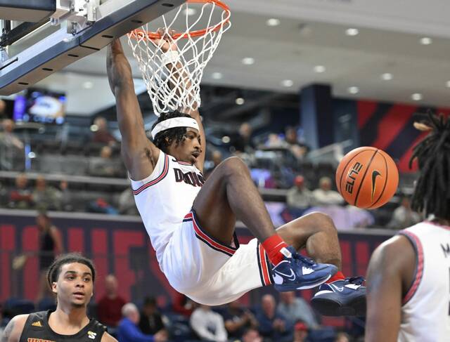 Duquesne’s Jimmy Clark III dunks against Winthrop on Dec. 21, 2022, at UPMC Cooper Fieldhouse.