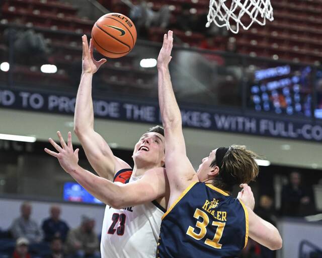 Duquesne’s Andrei Savrasov drives on UC Irvine’s Dean Keeler in the first half Wednesday at UPMC Cooper Fieldhouse. Savrasov led the Dukes with 15 points.