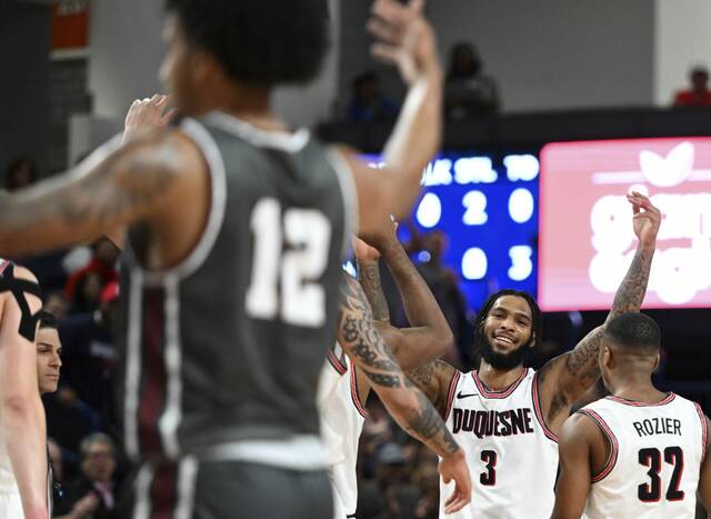 Duquesne’s Dae Dae Grant celebrates hitting a 3-pointer during a game earlier this season. Grant has more than 2,000 career points and ranks third in the nation in free-throw percentage (95.15%).