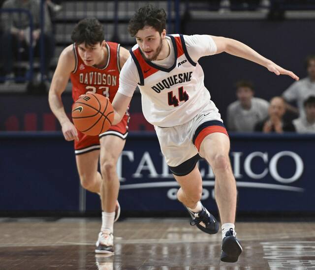 Duquesne’s Jake DiMichele steals the ball from Davidson’s Connor Kochera.