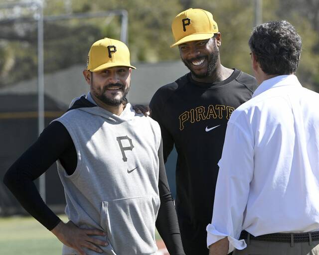 Pirates pitchers Martin Perez and Aroldis Chapman talk with team chairman Bob Nutting during a workout on Monday, Feb. 19, 2024, at Pirate City.