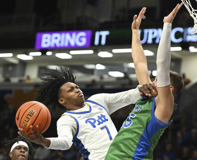 Pitt’s Bub Carrington is fouled by Florida Gulf Coast’s Chase Johnston in the first half Monday, Nov. 13, 2023 at Petersen Events Center.