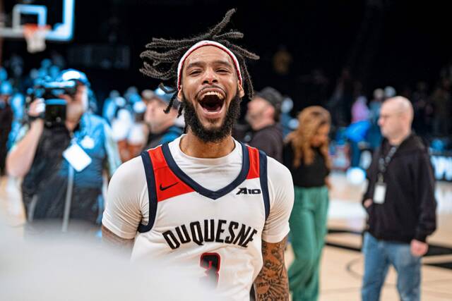 Duquesne’s Dae Dae Grant reacts after beating St. Bonaventure in the semifinals of the Atlantic 10 Tournament on Saturday in New York.