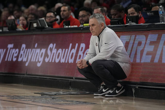 Duquesne head coach Keith Dambrot watches his team from the sideline during the first half of an NCAA college basketball game against Dayton in the quarterfinals of the Atlantic 10 tournament on Thursday in New York.