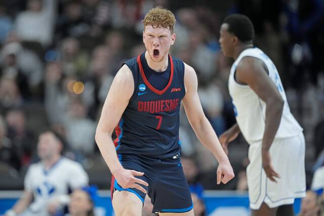 Duquesne forward Jakub Necas (7) celebrates after a 3-point basket against BYU in the first half of a first-round college basketball game in the NCAA Tournament, Thursday, March 21, 2024, in Omaha, Neb.