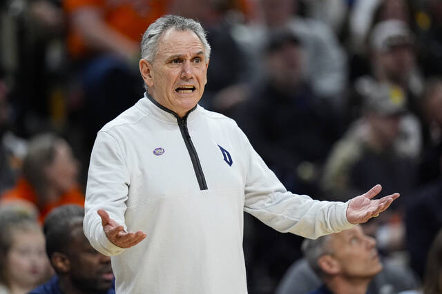 Duquesne coach Keith Dambrot gestures in the first half as he watches his Dukes play Illinois in an NCAA Tournament second-round game Saturday.