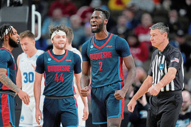 Duquesne forward David Dixon reacts during the first half of the Dukes’ first-round game March 21 against BYU in the NCAA Tournament in Omaha, Neb.