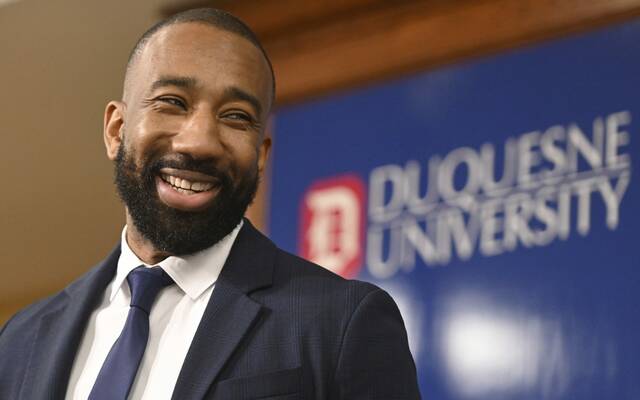 Duquesne’s new head men’s basketball coach Dru Joyce talks with reporters Monday, April 1, 2024, at Duquesne.