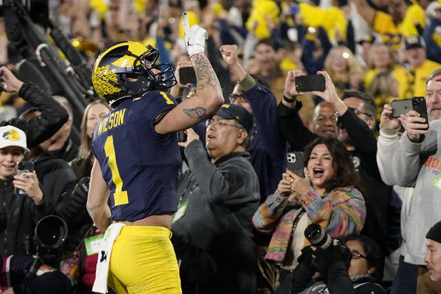 Michigan wide receiver Roman Wilson celebrates after scoring a touchdown during the second half in the Rose Bowl against Alabama last season.