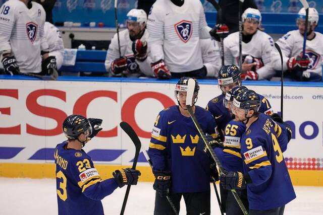 Sweden defenseman Erik Karlsson (No. 65) celebrates with teammates after scoring a goal during a preliminary round game against France at the International Ice Hockey Federation’s World Championship tournament in Ostrava, Czech Republic on Monday.