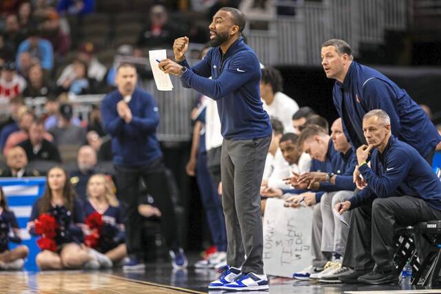 Notforsale Duquesne’s Dru Joyce III coaches from the sideilne against BYU on March 21, 2024. (Photo courtesy of Duquesne Athletics)