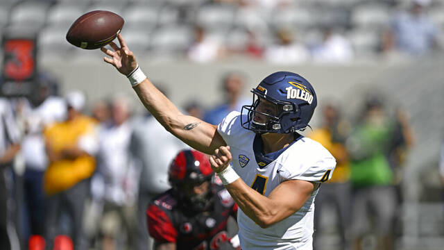 Toledo Rockets quarterback Tucker Gleason throws against the San Diego State Aztecs.