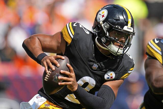 Pittsburgh Steelers quarterback Justin Fields (2) scrambles during the first half of an NFL football game against the Denver Broncos, Sunday, Sept. 15, 2024, in Denver.