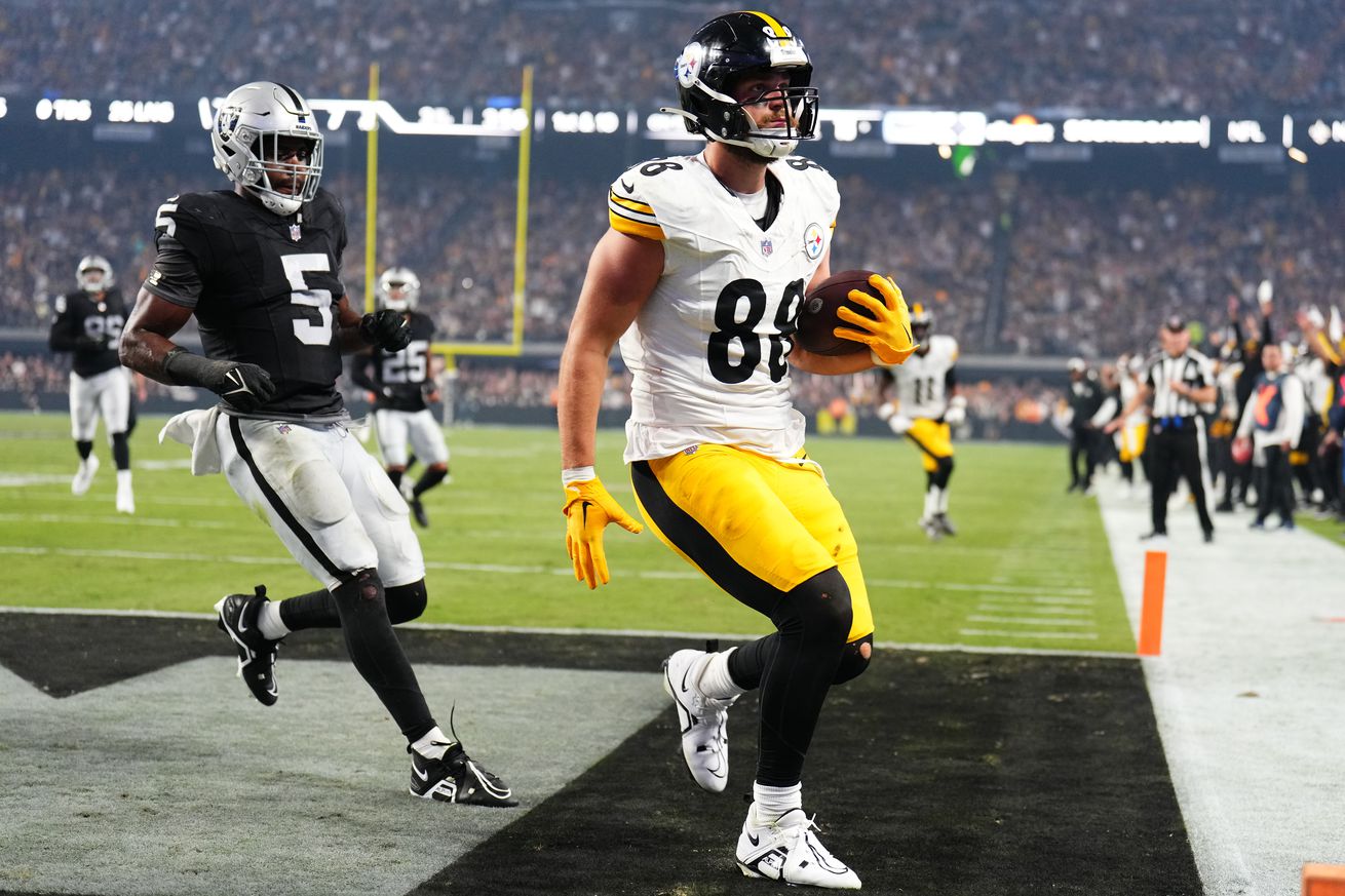 Pat Freiermuth #88 of the Pittsburgh Steelers scores a touchdown in the game against the Las Vegas Raiders during the third quarter at Allegiant Stadium on September 24, 2023 in Las Vegas, Nevada.