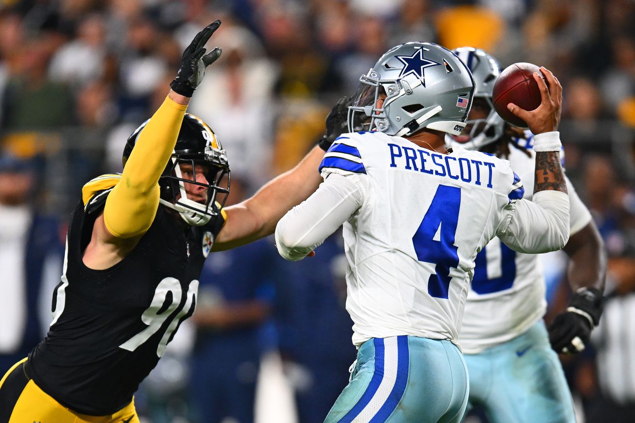 Dak Prescott #4 of the Dallas Cowboys is pressured by T.J. Watt #90 of the Pittsburgh Steelers during the first quarter at Acrisure Stadium on October 06, 2024 in Pittsburgh, Pennsylvania.