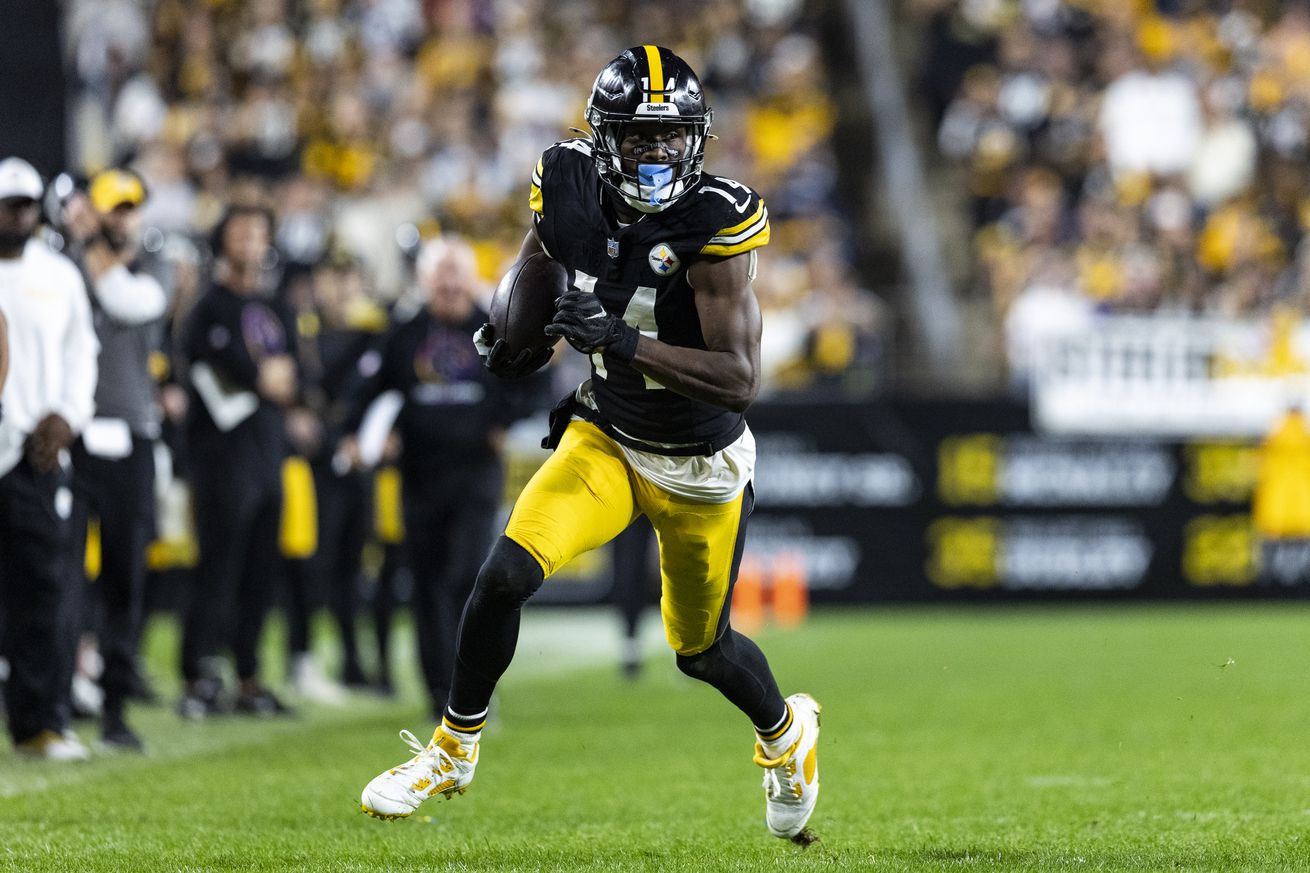 George Pickens #14 of the Pittsburgh Steelers runs the ball during the fourth quarter against the Dallas Cowboys at Acrisure Stadium on October 7, 2024 in Pittsburgh, Pennsylvania. The Cowboys beat the Steelers 20-17.