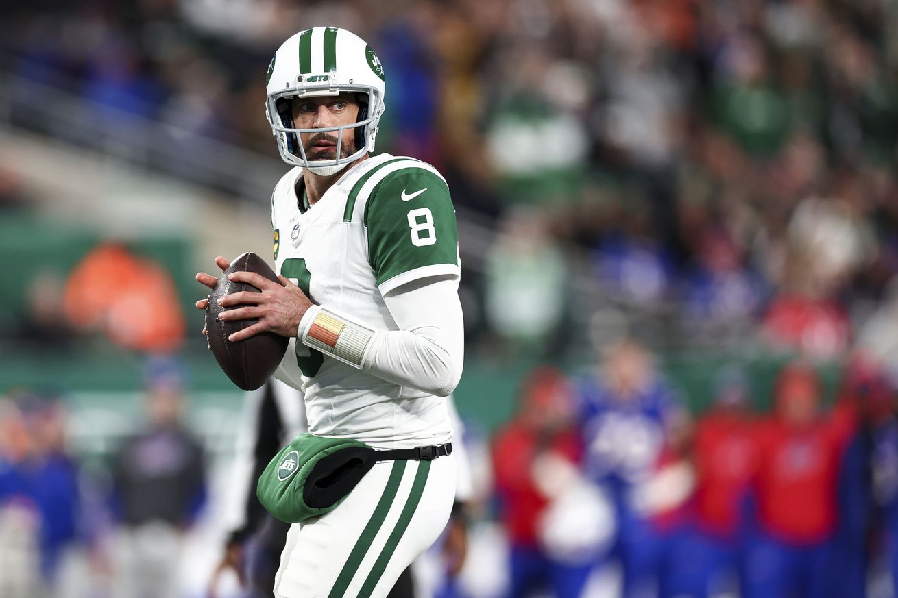 Aaron Rodgers #8 of the New York Jets drops back to pass during the second half of an NFL game against the Buffalo Bills at MetLife Stadium on October 14, 2024 in East Rutherford, New Jersey.