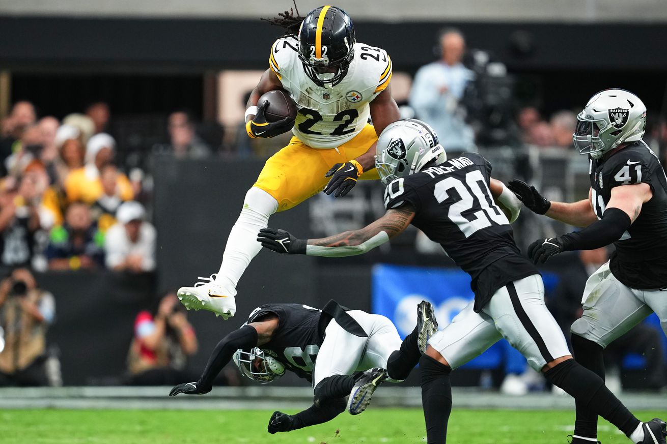 Pittsburgh Najee Harris #22 of the Pittsburgh Steelers hurdles Jack Jones #18 of the Las Vegas Raiders in the second quarter of a game at Allegiant Stadium on October 13, 2024 in Las Vegas, Nevada. v Las Vegas Raiders