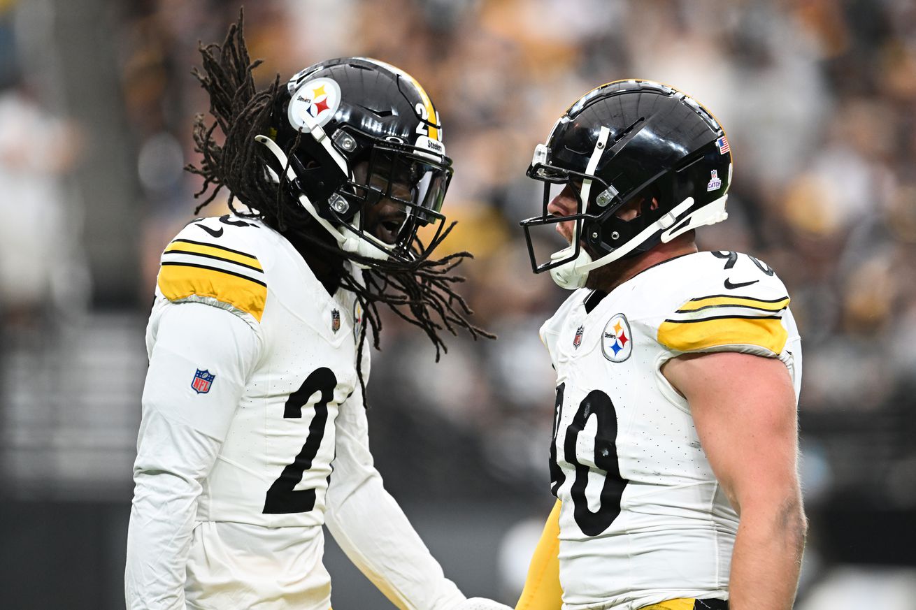 T.J. Watt #90 and Donte Jackson #26 of the Pittsburgh Steelers react after a play in the second quarter of a game against the Las Vegas Raiders at Allegiant Stadium on October 13, 2024 in Las Vegas, Nevada.