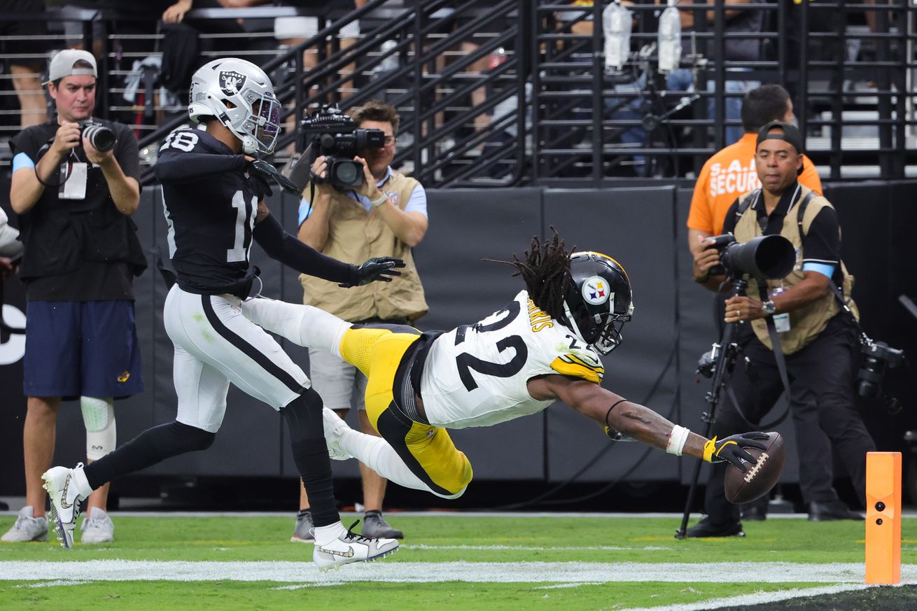  Najee Harris #22 of the Pittsburgh Steelers dives for a touchdown against Jack Jones #18 of the Las Vegas Raiders in the third quarter of a game at Allegiant Stadium on October 13, 2024 in Las Vegas, Nevada.