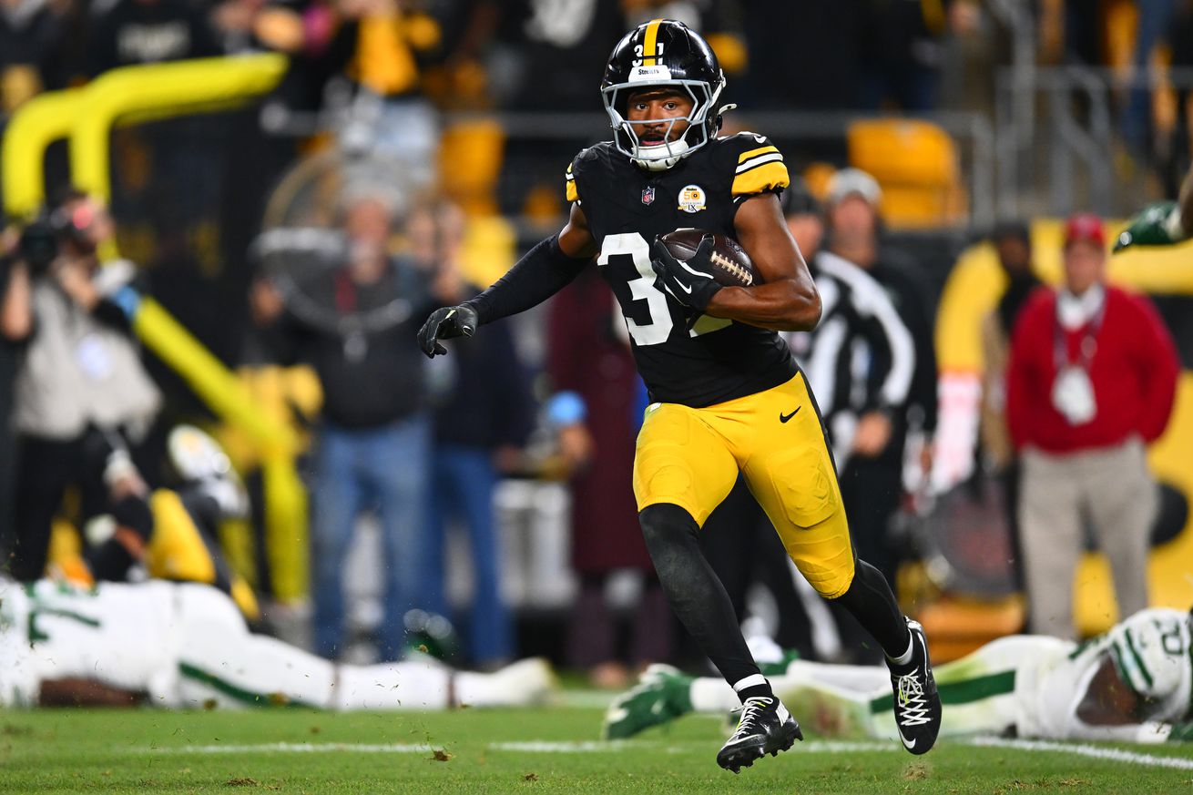 Beanie Bishop Jr. #31 of the Pittsburgh Steelers runs the ball after an interception during the third quarter against the New York Jets at Acrisure Stadium on October 20, 2024 in Pittsburgh, Pennsylvania.