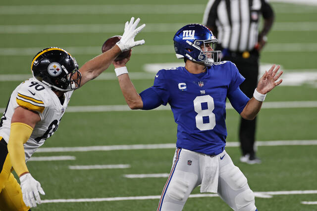 Giants quarterback Daniel Jones has the ball knocked down by Steelers outside linebacker T.J. Watt in a Sept. 14, 2020, game in East Rutherford, N.J.