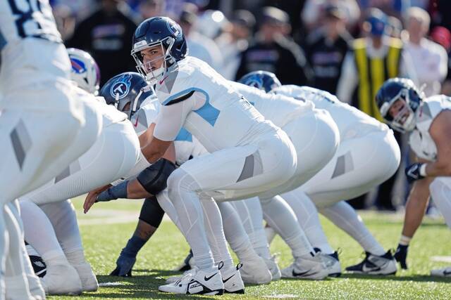 Titans quarterback Mason Rudolph prepares to take a snap Sunday in Orchard Park, N.Y., against the Buffalo Bills.