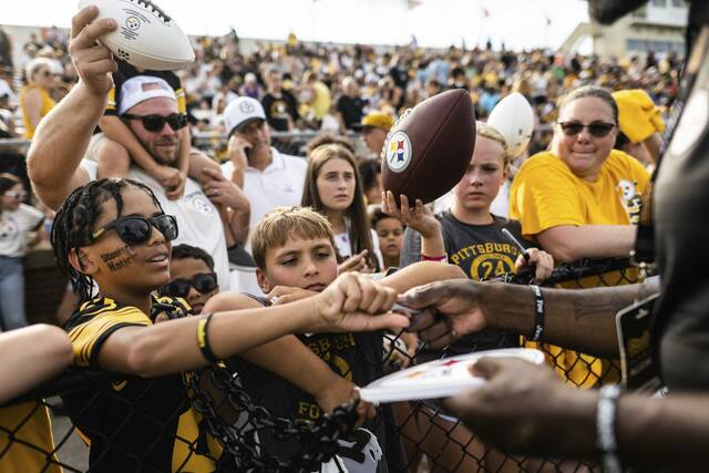 Fans clamor to get autographs Aug. 2 during the Pittsburgh Steelers’ Friday Night Lights team practice at Latrobe Memorial Stadium in Latrobe.