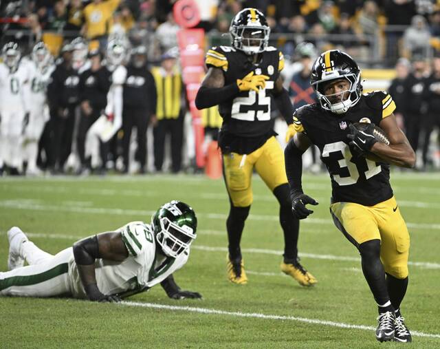 The Steelers’ Beanie Bishop returns a second quarter interception against the Jets on Sunday at Acrisure Stadium.