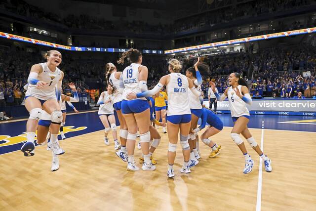 The Pitt women’s volleyball team celebrates after beating Louisville, 3-2, on Oct. 25, 2024, at the Petersen Events Center.