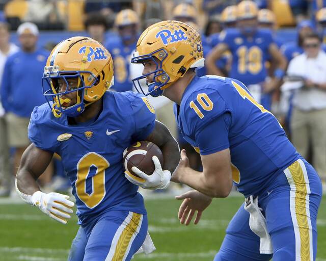 Pitt’s Desmond Reid carries for a touchdown next to quarterback Eli Holstein during the first quarter against California on Saturday, Oct. 12, 2024, at Acrisure Stadium.