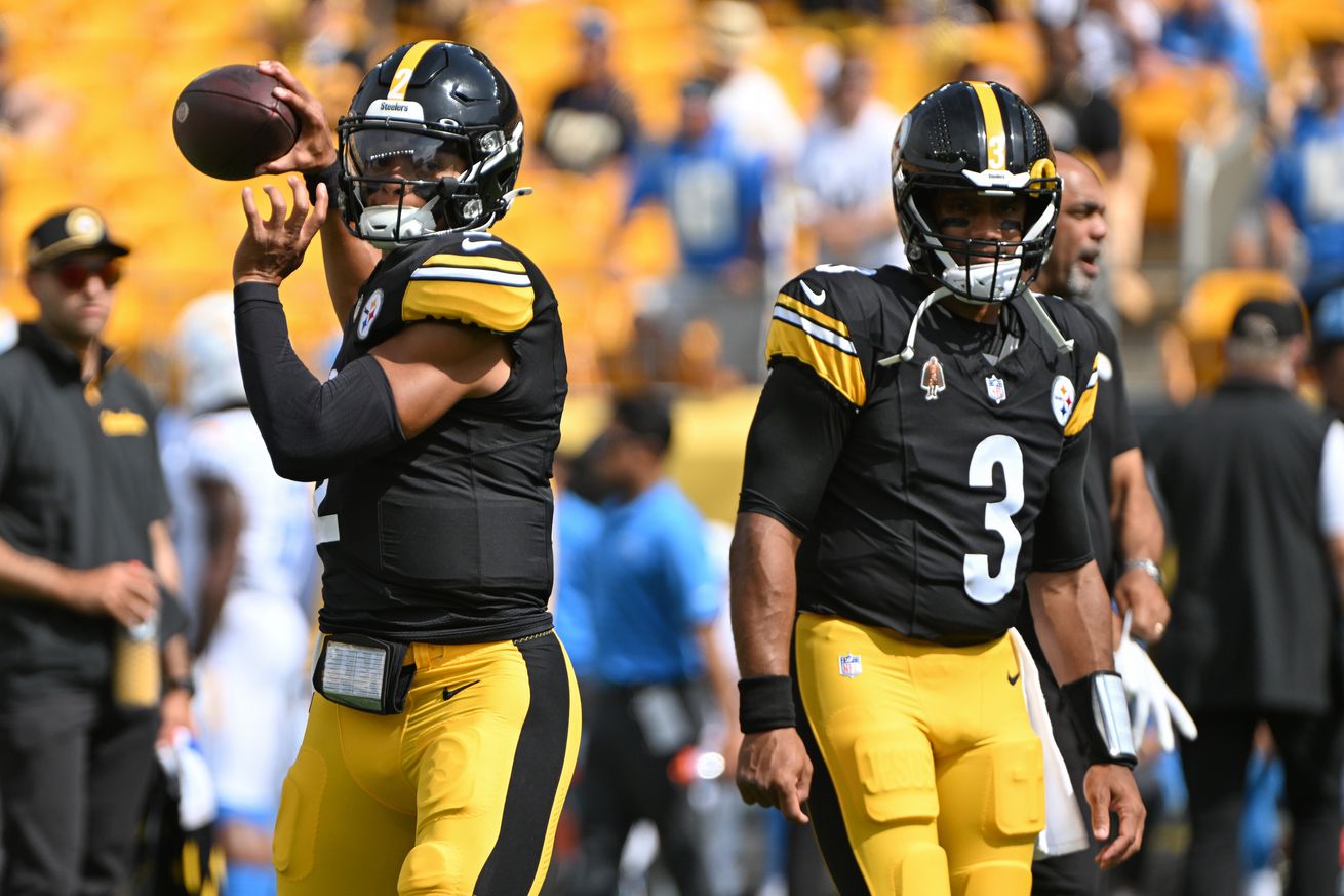 Pittsburgh, Pennsylvania, USA; Pittsburgh Steelers quarterback Justin Fields (2) warms up next to quarterback Russell Wilson (3) before a game against the Los Angeles Chargers at Acrisure Stadium.