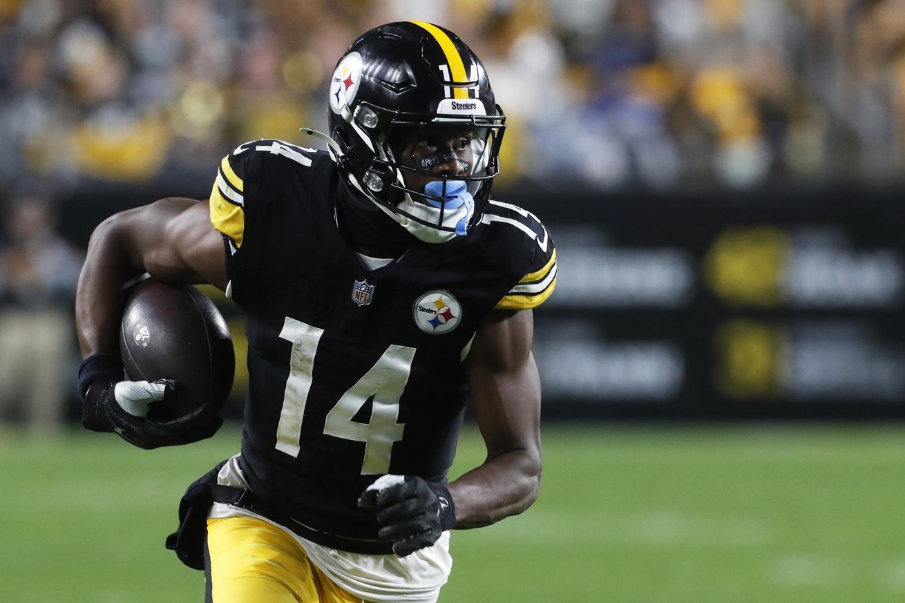 Pittsburgh Steelers wide receiver George Pickens (14) runs after a catch against the Dallas Cowboys during the fourth quarter at Acrisure Stadium. Dallas won 20-17.