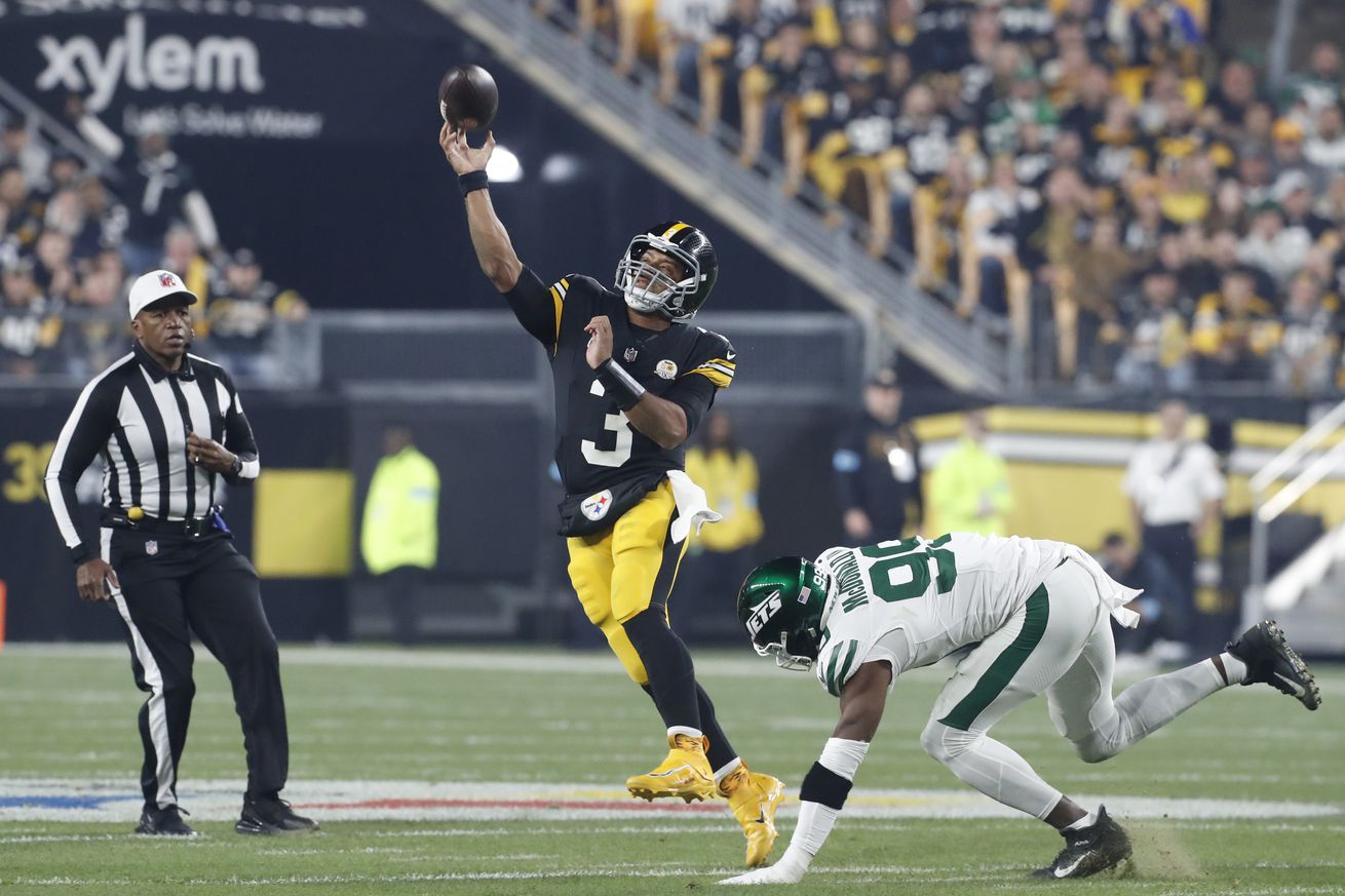 Pittsburgh, Pennsylvania, USA; Pittsburgh Steelers quarterback Russell Wilson (3) passes against pressure from New York Jets defensive end Will McDonald IV (99) during the first quarter at Acrisure Stadium.