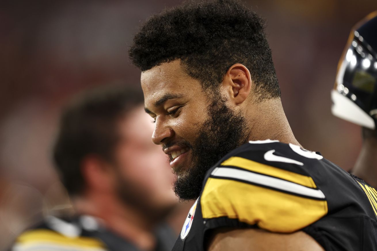 Dylan Cook #60 of the Pittsburgh Steelers smiles on the sidelines during an NFL preseason football game against the Tampa Bay Buccaneers at Raymond James Stadium on August 11, 2023 in Tampa, Florida.