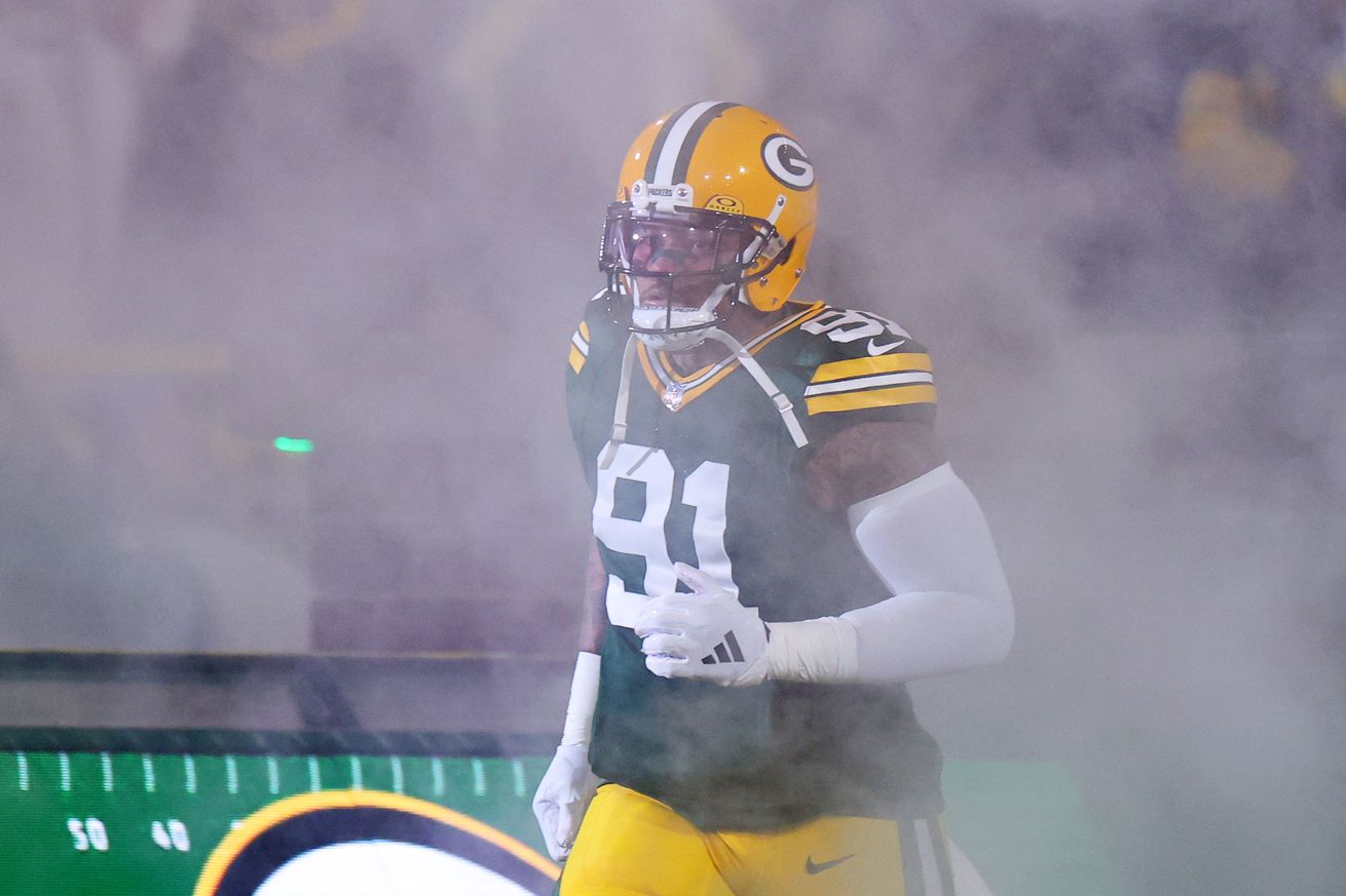 Preston Smith #91 of the Green Bay Packers takes the field for player introductions prior to a game against the Kansas City Chiefs at Lambeau Field on December 03, 2023 in Green Bay, Wisconsin. The Packers defeated the Chiefs 27-19.