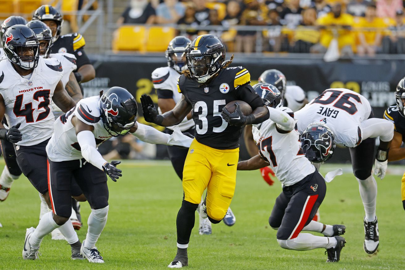 Jonathan Ward #35 of the Pittsburgh Steelers rushes against D’Angelo Ross #37 of the Houston Texans in the first half of a preseason game on August 9, 2024 at Acrisure Stadium in Pittsburgh, Pennsylvania.