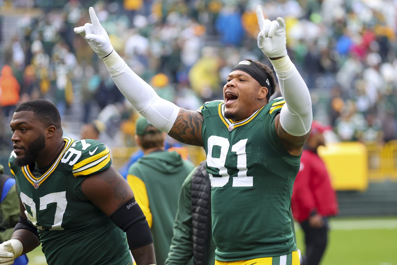 Preston Smith #91 of the Green Bay Packers reacts after defeating the Arizona Cardinals 34-13 at Lambeau Field on October 13, 2024 in Green Bay, Wisconsin.