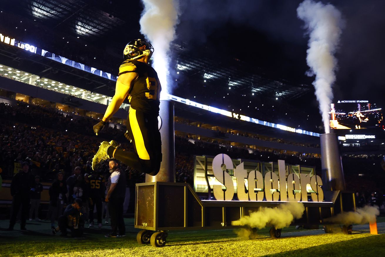 T.J. Watt #90 of the Pittsburgh Steelers runs onto the field during player introductions prior to the game against the New York Giants at Acrisure Stadium on October 28, 2024 in Pi