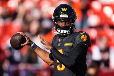 Washington Commanders rookie quarterback Jayden Daniels warms up before kick-off with the Chicago Bears from Northwest Stadium in Landover, Maryland. 