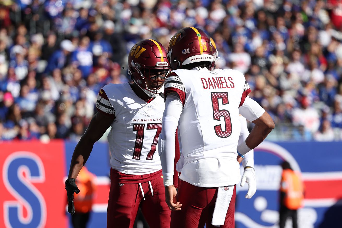 Terry McLaurin #17 of the Washington Commanders celebrates a touchdown with Jayden Daniels #5 during the first quarter against the New York Giants at MetLife Stadium on November 03, 2024 in East Rutherford, New Jersey.