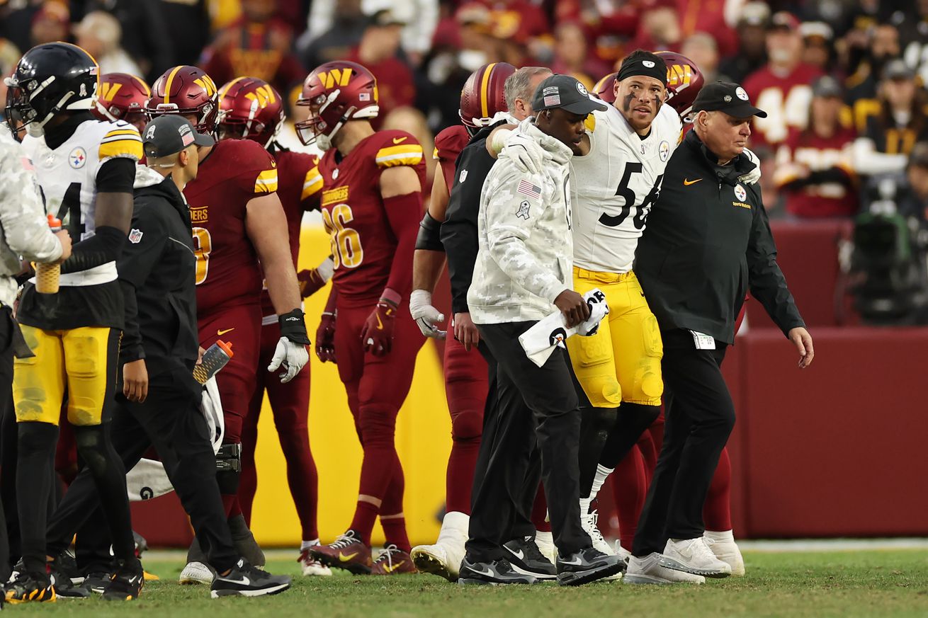 Alex Highsmith #56 of the Pittsburgh Steelers is helped off the field in the fourth quarter of a game against the Washington Commanders at Northwest Stadium on November 10, 2024 in Landover, Maryland.