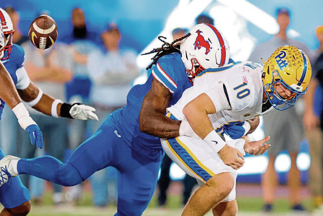 Pitt quarterback Eli Holstein (fumbles as he is sacked by SMU defensive end Jahfari Harvey during the first half Saturday.