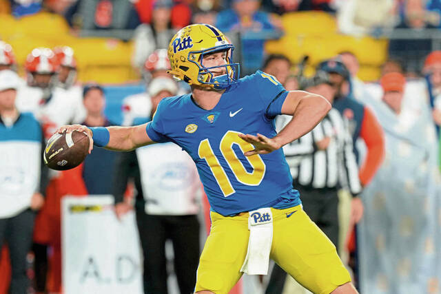 Pitt quarterback Eli Holstein (10) looks to throw during the first half of an NCAA college football game against Syracuse, Thursday, Oct. 24, 2024, in Pittsburgh.